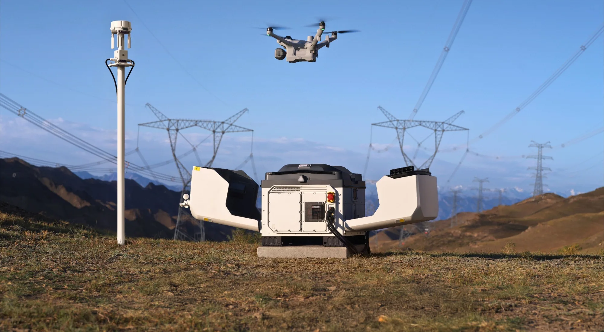 DJI Enterprise drone and docking station inspecting high-voltage power lines